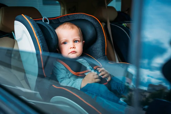 Cute Little Baby Sitting Child Safety Seat Car Looking Window — стоковое фото